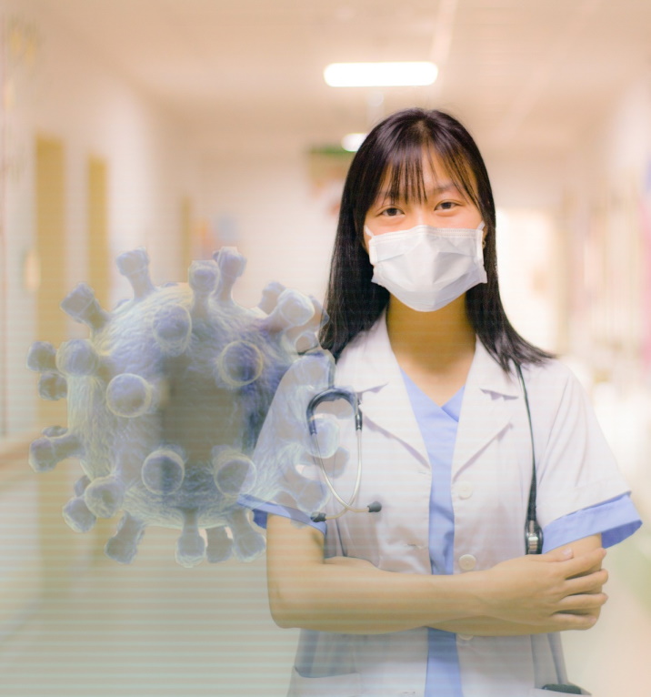 Female healthcare worker in a mask standing confidently in a hospital hallway with a 3D illustration of a virus in the foreground